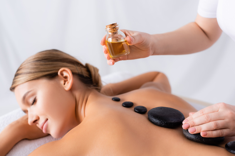 Woman receiving hot stone massage